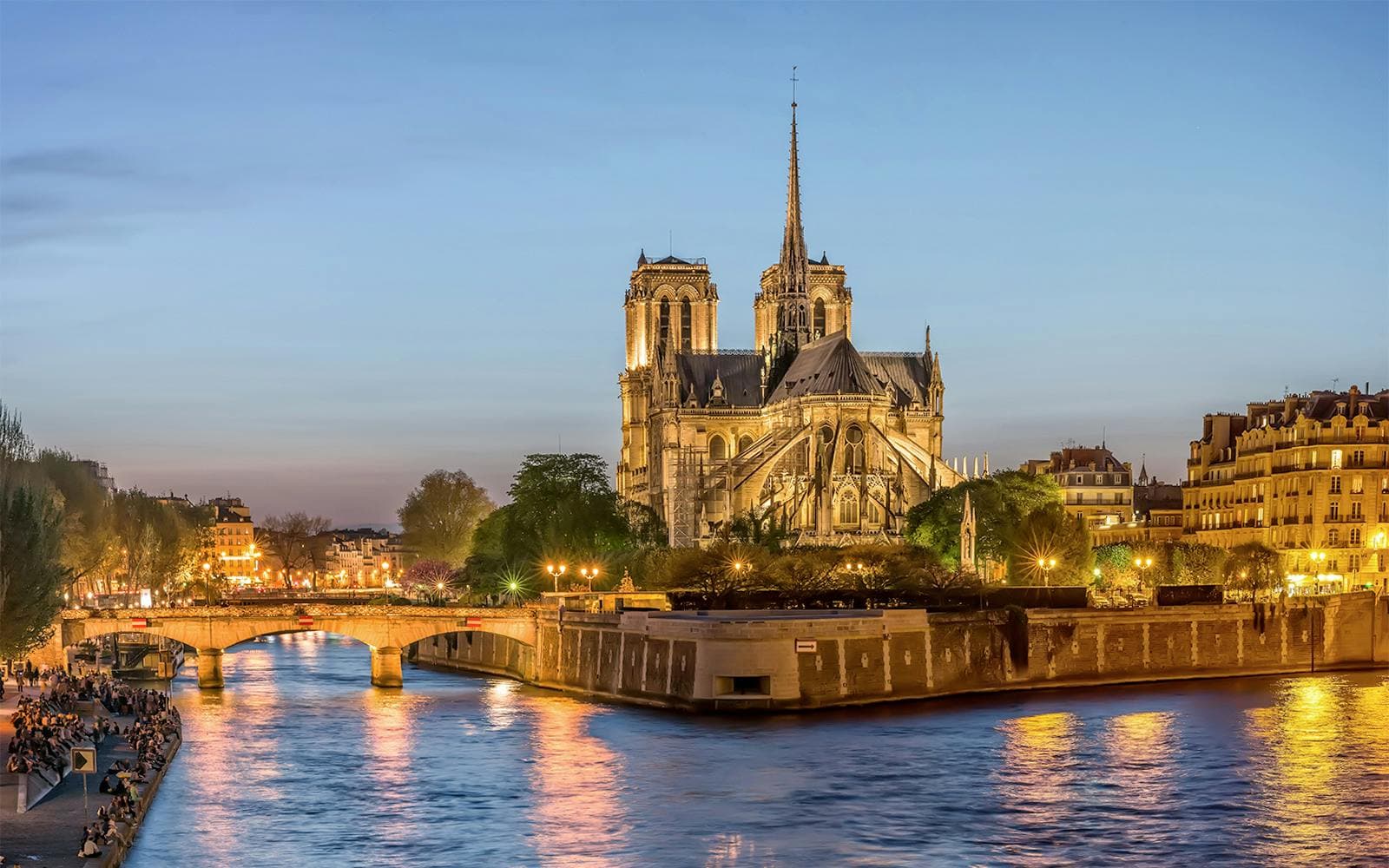https://cdn-imgix.headout.com/media/images/74a48d43bb23aa50b9079728e73447f2-NotreDameatNight.jpg