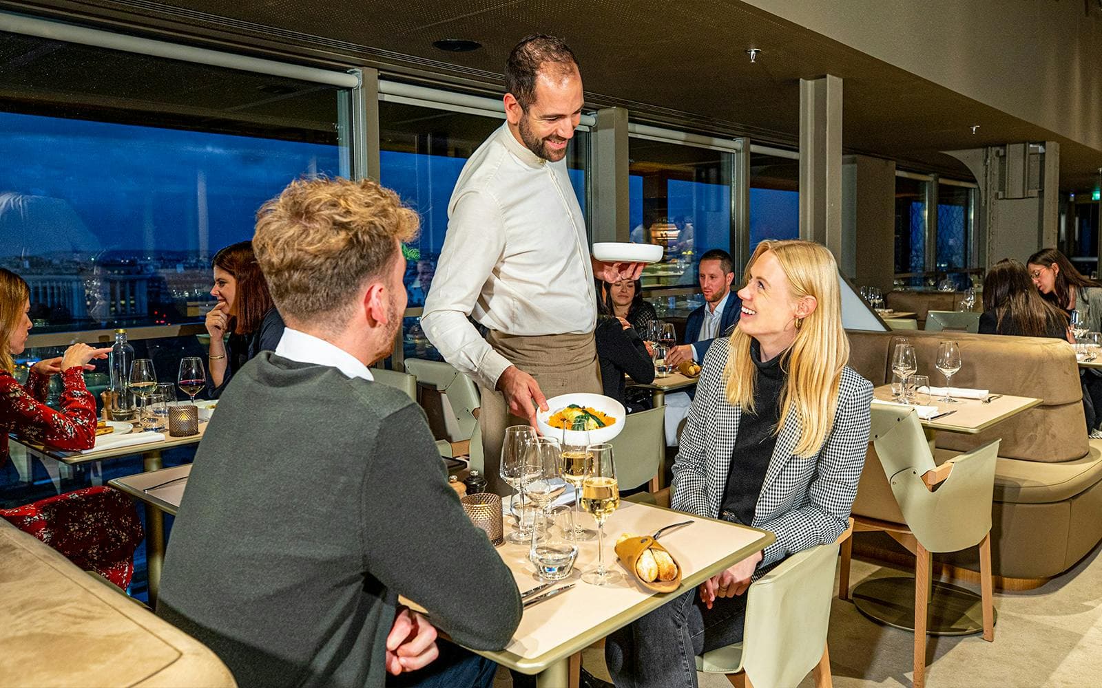 https://cdn-imgix.headout.com/media/images/f28d2f1577296a98d3b4bb7e31f66a0e-19850-paris-dinner-at-eiffel-tower-s-madame-brasserie-02.jpg