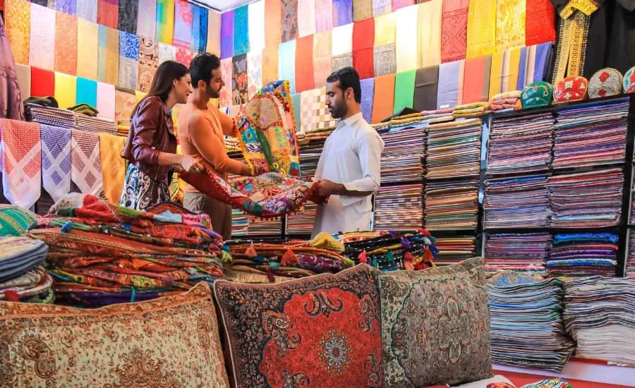 https://travjoy.s3.ap-south-1.amazonaws.com/Textile_Souk_Old_Dubai_a6b681ef4c.webp