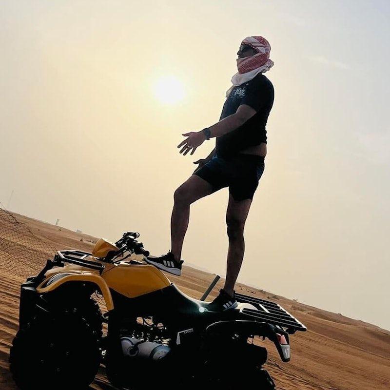Sunset Desert Safari: Quad Bike, Sandboarding, Camel Ride + BBQ Dinner